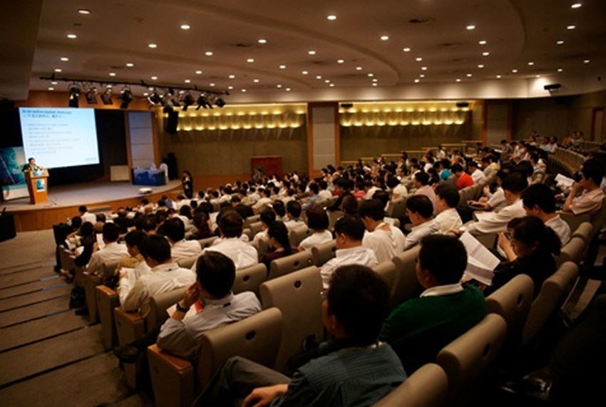 Conference speaker presenting to audience